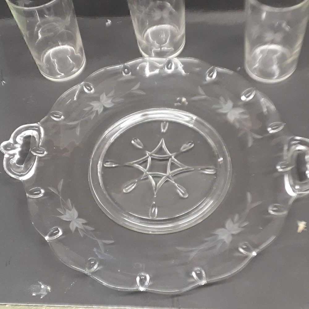 Etched flower/leaf design tray with handles and star design in middle